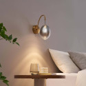 Goldene bogenförmige LED-Wandleuchte mit hängender ovaler Kugel - Nuvéo